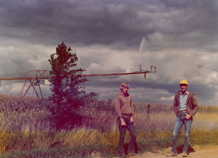 Dan Loberg learns pivot irrigation management from his dad, Glen. 